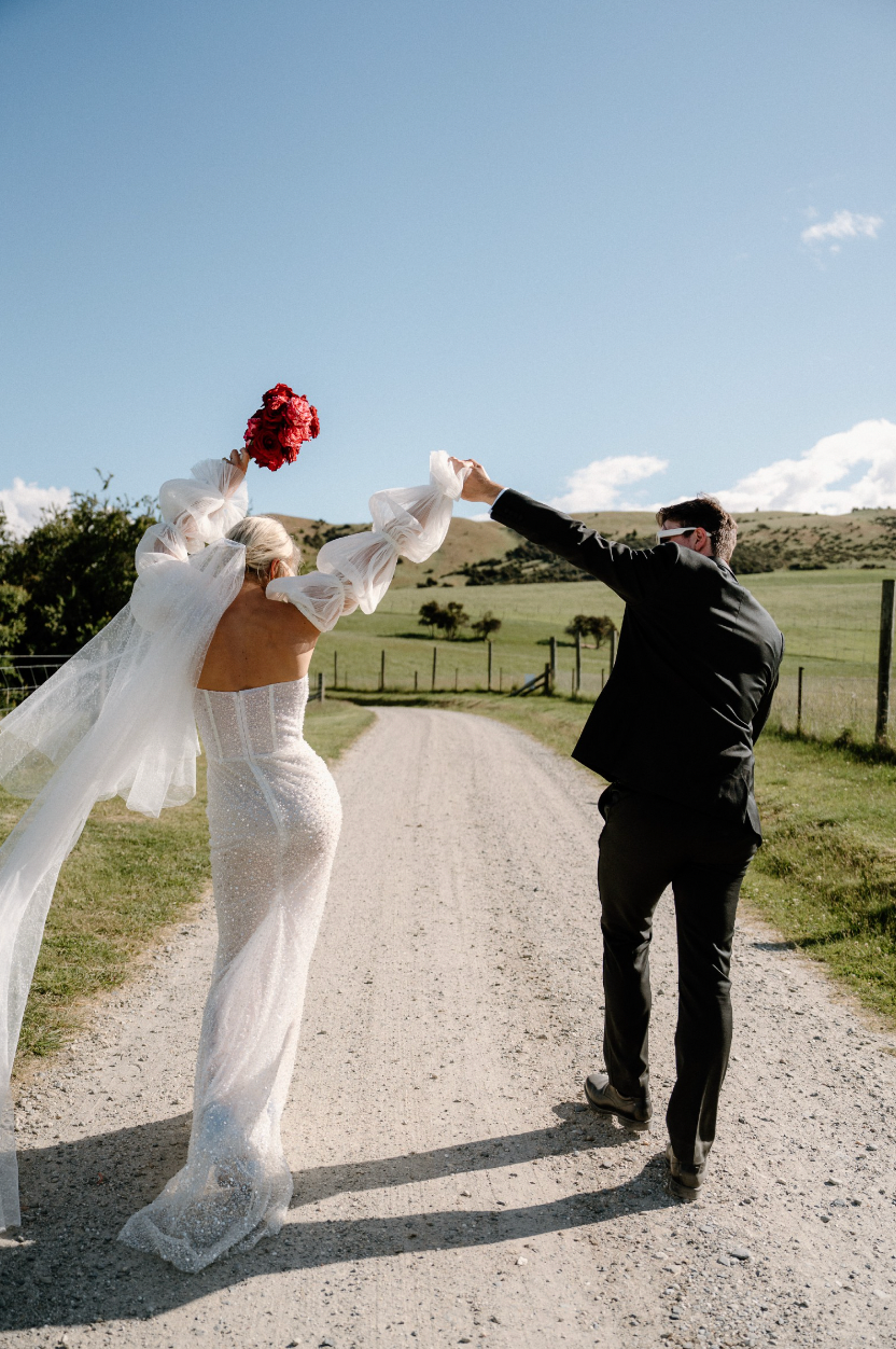 Take a risk on your wedding day with the Stella Dress! This stunning dress features a sequinned tulle column silhouette and a structured sweetheart bodice for a bold and statement-making look. Perfect for the daring bride who wants to stand out and make an unforgettable entrance.