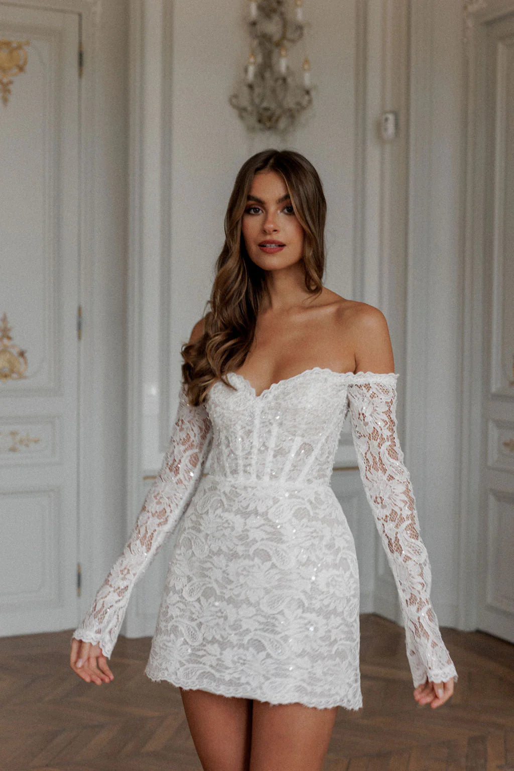 Expertly crafted with lace appliques and an elegant off shoulder design, the Robe Noemie is the perfect choice for any special occasion. The heart shaped neck adds a touch of romance to this elegant white mini dress. Make a statement and feel confident and beautiful all night long.