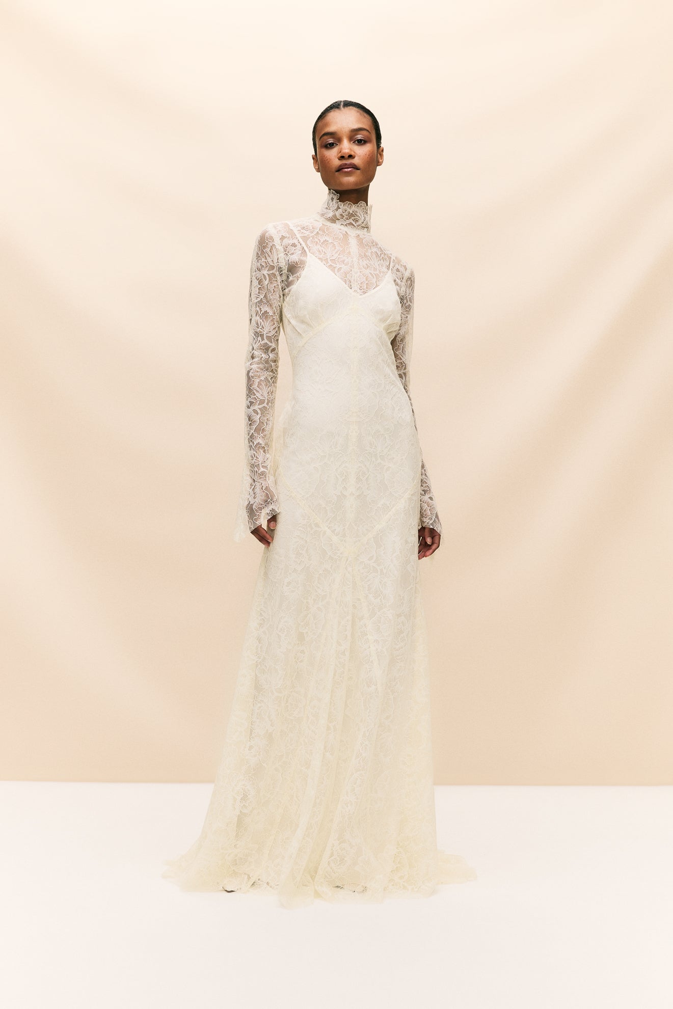 Look stunning on your special day with the Hermosa Dress, crafted from delicate vintage inspired lace that truly embodies our bohemian heritage. Featuring a flattering high neckline, long sleeves, and opulent button detailing, this style exudes effortless elegance. The romantic and sheer qualities of the lace add a touch of romance to your look.