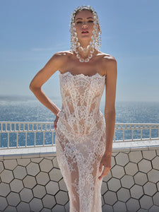 Indulge in pure luxury with the Eva Gown by Galia Lahav. This two-piece ensemble boasts a baroque-style strapless corset and an elongated mermaid skirt, both crafted from opulent embroidered French lace. The result is a striking and timeless silhouette that radiates elegance and grandeur. Elevate your style and make a statement with the Eva Gown.