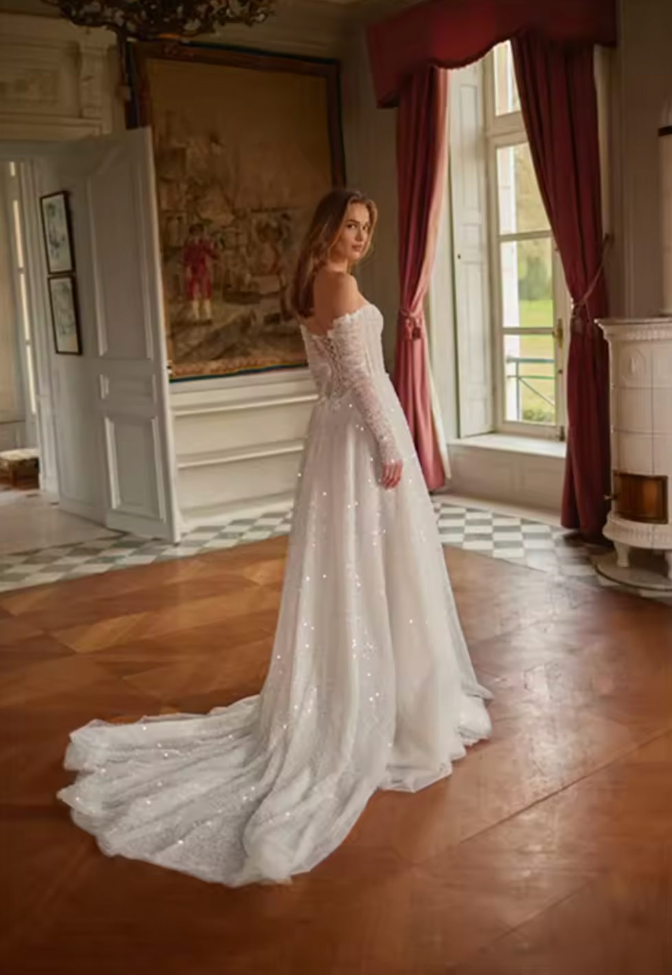 The Marine Gown is the epitome of luxury and elegance. With its off-the-shoulder design and delicate pearl detailing, this A-line wedding dress will make any bride feel like a princess on her special day. The long sleeves provide a touch of sophistication, while the bespoke tailoring ensures a perfect fit. Say "I do" in style with this stunning gown.