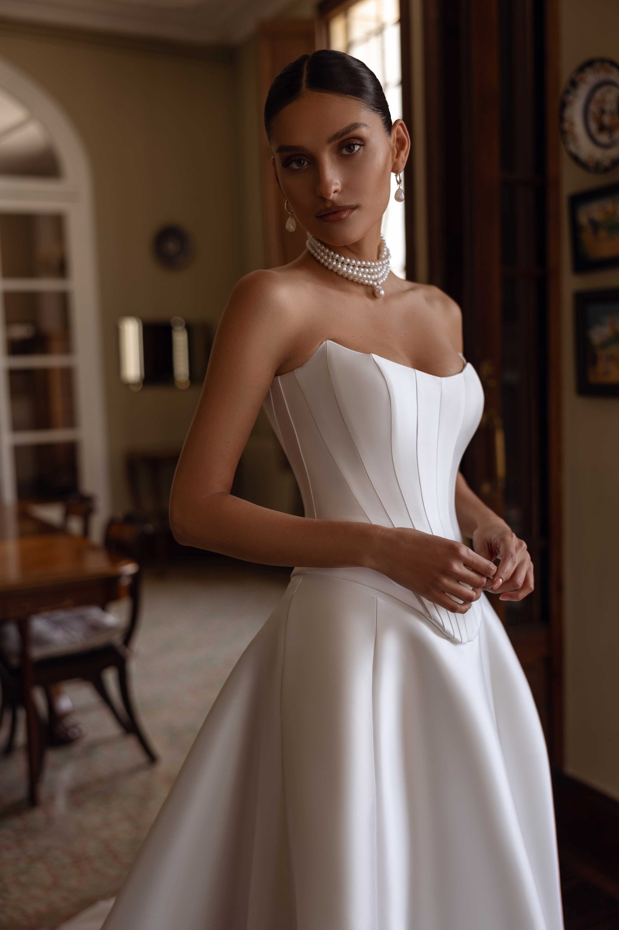 Indulge in luxury with the Florentina Gown. This exquisite satin corset bridal gown boasts an elegant and chic design, perfect for an enchanted wedding. Elevate your special day with this timeless and luxurious wedding dress.