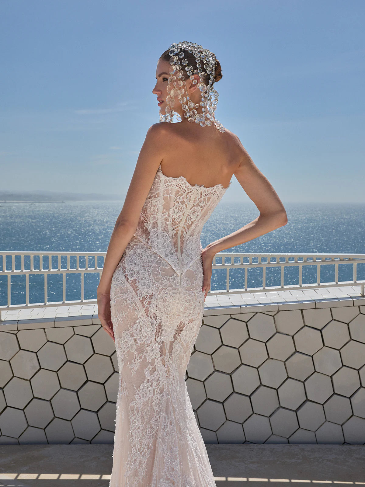 Indulge in pure luxury with the Eva Gown by Galia Lahav. This two-piece ensemble boasts a baroque-style strapless corset and an elongated mermaid skirt, both crafted from opulent embroidered French lace. The result is a striking and timeless silhouette that radiates elegance and grandeur. Elevate your style and make a statement with the Eva Gown.