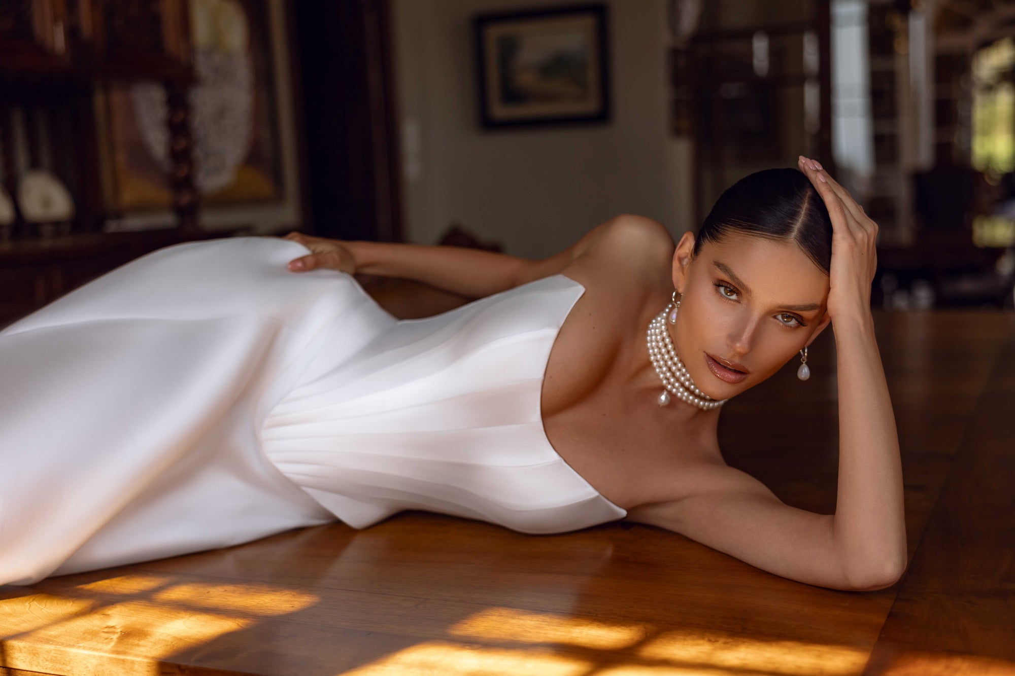 Indulge in luxury with the Florentina Gown. This exquisite satin corset bridal gown boasts an elegant and chic design, perfect for an enchanted wedding. Elevate your special day with this timeless and luxurious wedding dress.