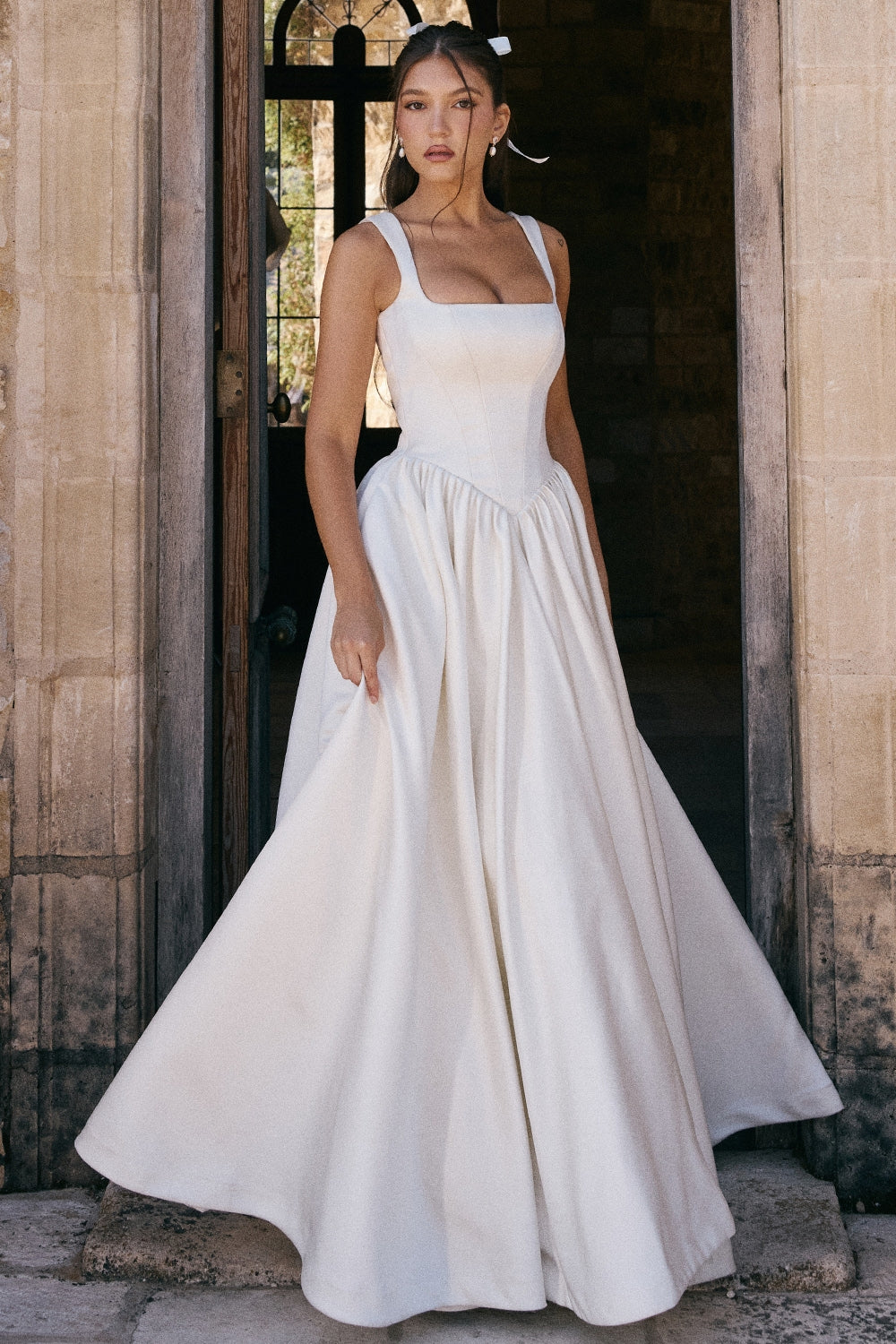 'Liliana' gown is so luxurious and such an elegant choice for your special day. Made from a lustrous heavyweight Italian Satin 'Liliana' is a grown up fairytale. It has a beautifully corseted bodice that cinches the waist to perfection.