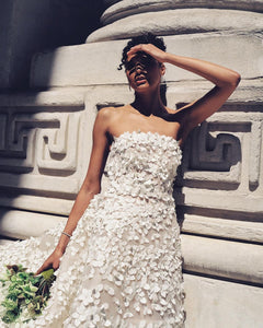 The Robe Anastasiya is a stunning bridal gown, featuring exquisite embroidery of delicate flowers. This masterpiece of design is perfect for any wedding, adding a touch of elegance to your special day. With its beautiful details and expert craftsmanship, the Robe Anastasiya is sure to make you feel like a princess on your big day.