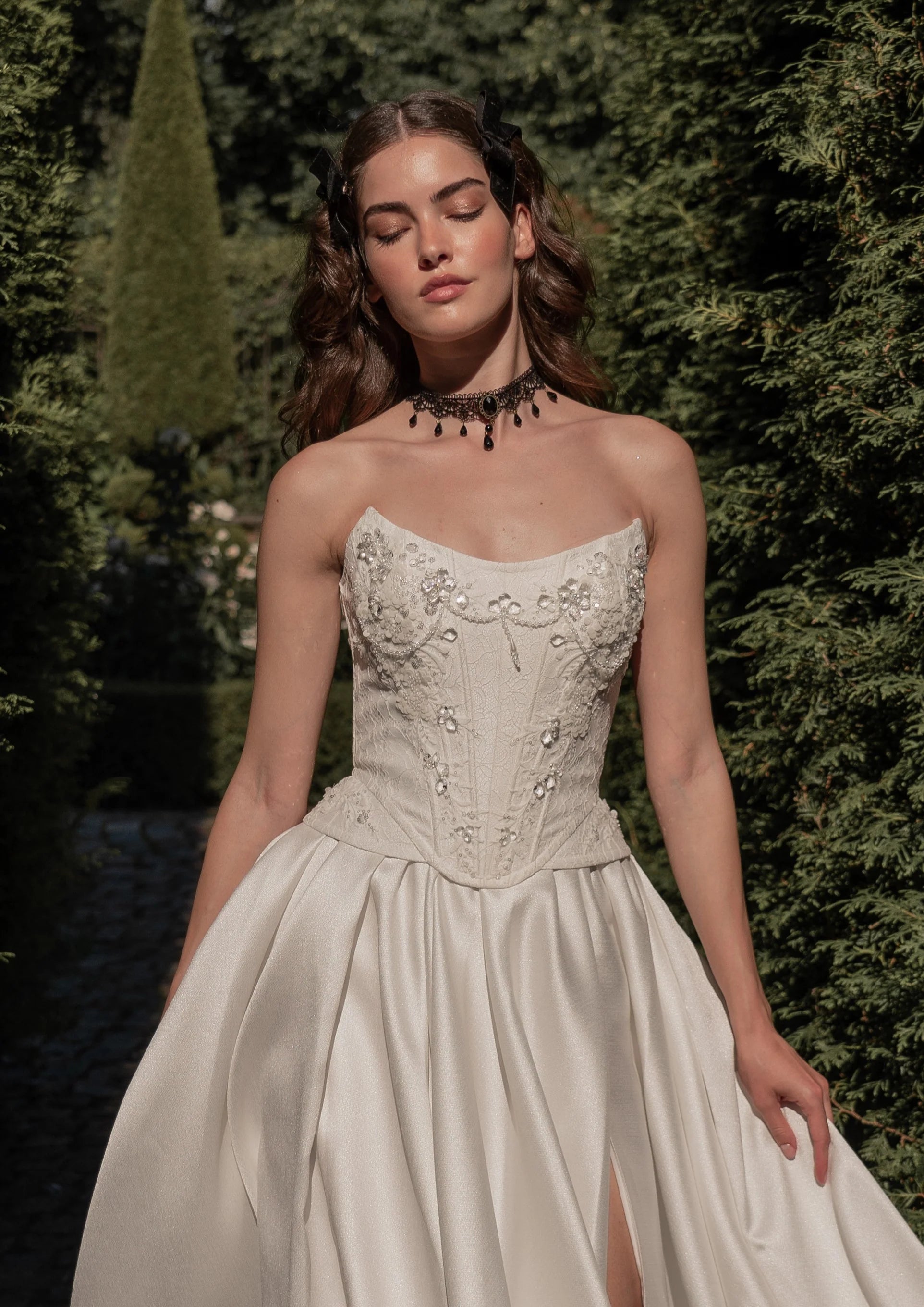 Radiate elegance on your special day with the stunning A-line Kristal Gown. The flattering strapless corset accentuates your silhouette, providing both support and charm. The lace-up back adds a touch of vintage charm and allows for a customized fit. With its graceful flow and long train, this gown makes a stunning statement as you walk down the aisle.