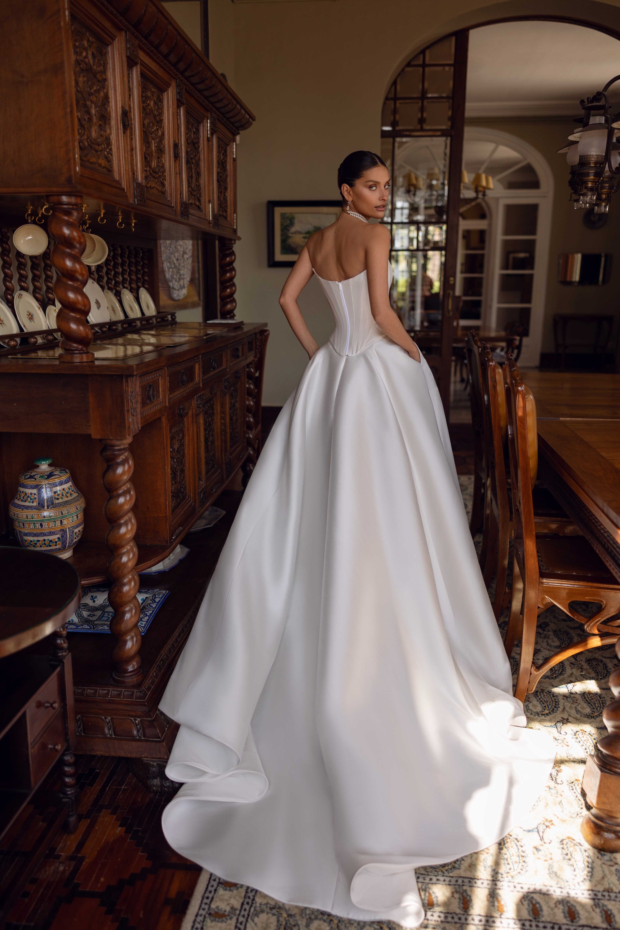 Indulge in luxury with the Florentina Gown. This exquisite satin corset bridal gown boasts an elegant and chic design, perfect for an enchanted wedding. Elevate your special day with this timeless and luxurious wedding dress.