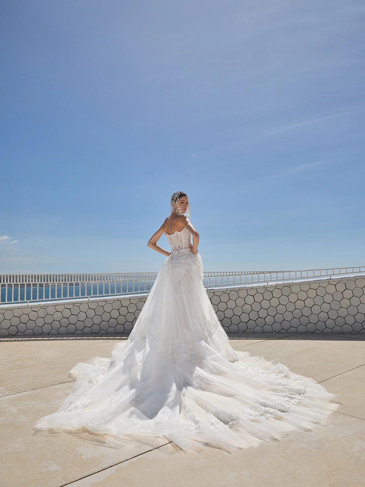 Indulge in pure luxury with the Eva Gown by Galia Lahav. This two-piece ensemble boasts a baroque-style strapless corset and an elongated mermaid skirt, both crafted from opulent embroidered French lace. The result is a striking and timeless silhouette that radiates elegance and grandeur. Elevate your style and make a statement with the Eva Gown.