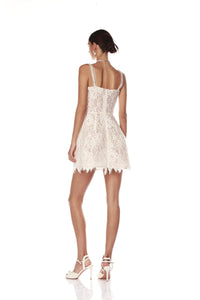 Elevate your bridal look with the Colette Lace Mini Dress. The sweetheart neckline and butterfly embellishments exude feminine grace, while the boned bodice and structured skirt provide a flattering silhouette. The hidden adjustable straps ensure a comfortable fit, making this dress perfect for your special day.