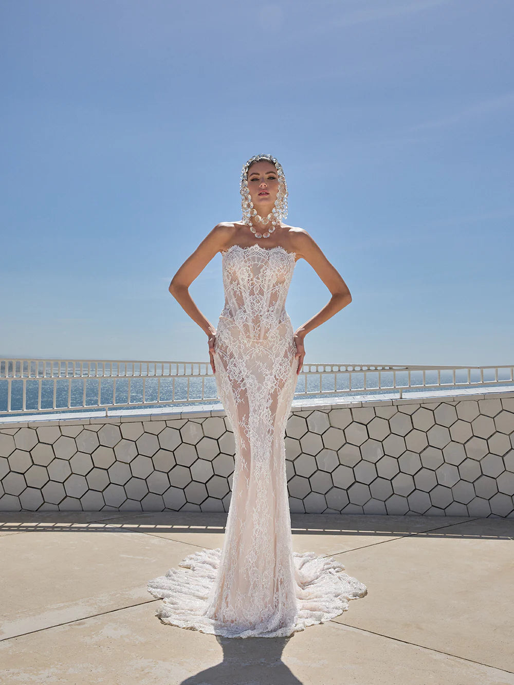 Indulge in pure luxury with the Eva Gown by Galia Lahav. This two-piece ensemble boasts a baroque-style strapless corset and an elongated mermaid skirt, both crafted from opulent embroidered French lace. The result is a striking and timeless silhouette that radiates elegance and grandeur. Elevate your style and make a statement with the Eva Gown.