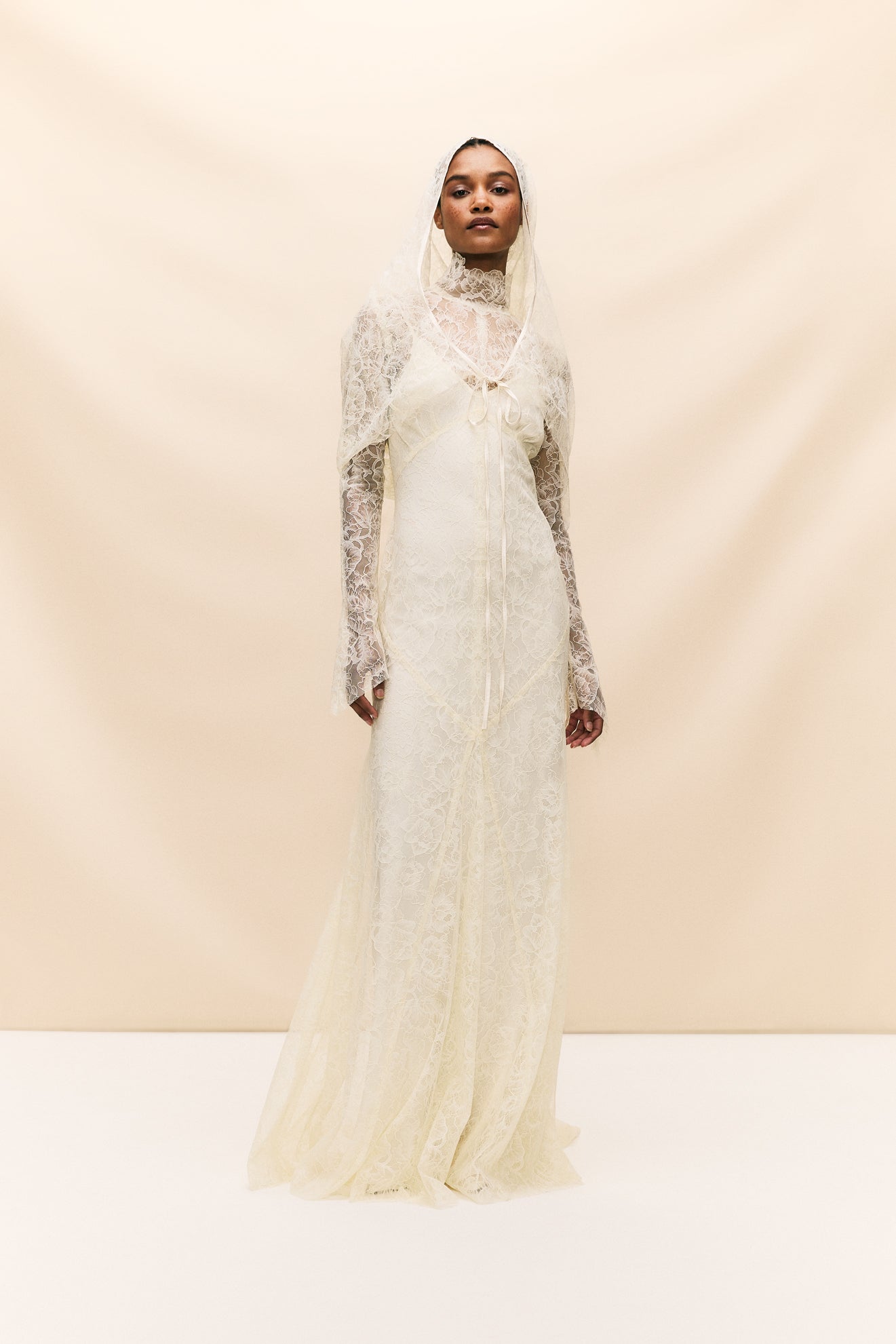 Look stunning on your special day with the Hermosa Dress, crafted from delicate vintage inspired lace that truly embodies our bohemian heritage. Featuring a flattering high neckline, long sleeves, and opulent button detailing, this style exudes effortless elegance. The romantic and sheer qualities of the lace add a touch of romance to your look.