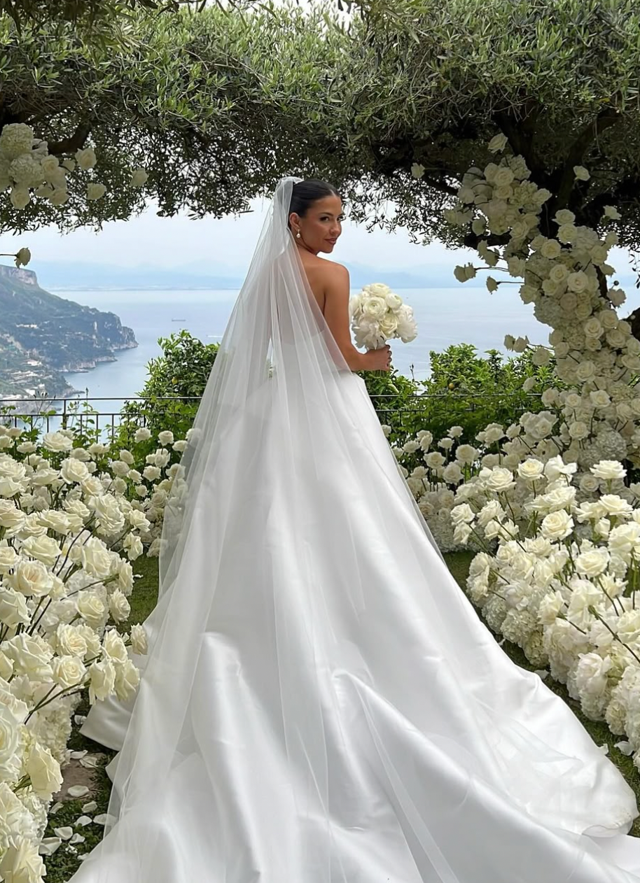 Be the bride of everyone's dreams with the Eva Gown. This chic and simple white satin dress exudes elegance and romance, making you feel like a fairytale princess on your special day. Say "I do" to this dreamy and stylish gown.