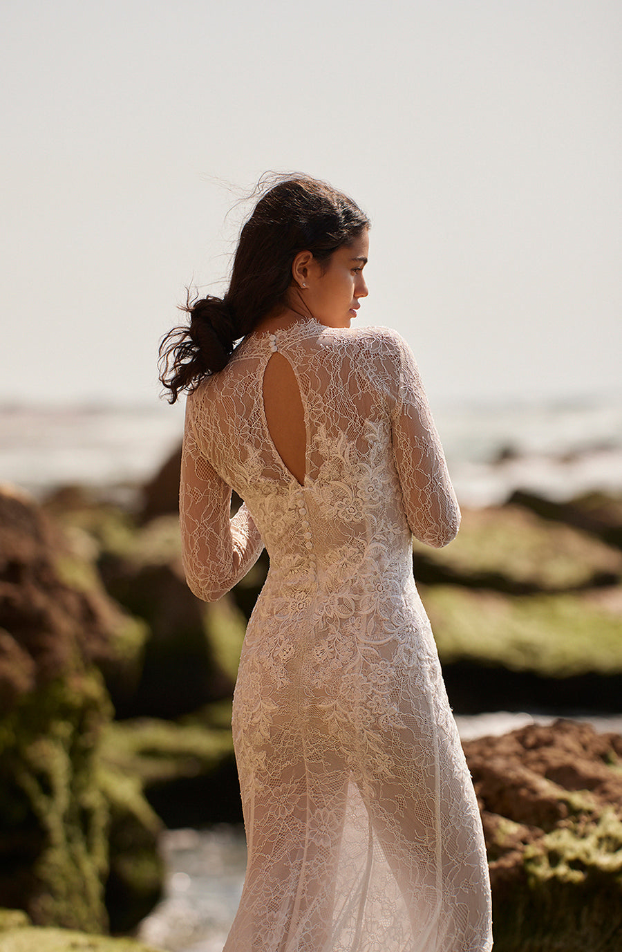 Glimmer with grace in the glamorous Robe Adrianna. This ethereal white lace mermaid dress features long sleeves for a timeless look, perfect for your most special of occasions. Experience luxury with a touch of romance, all in one breathtaking dress.