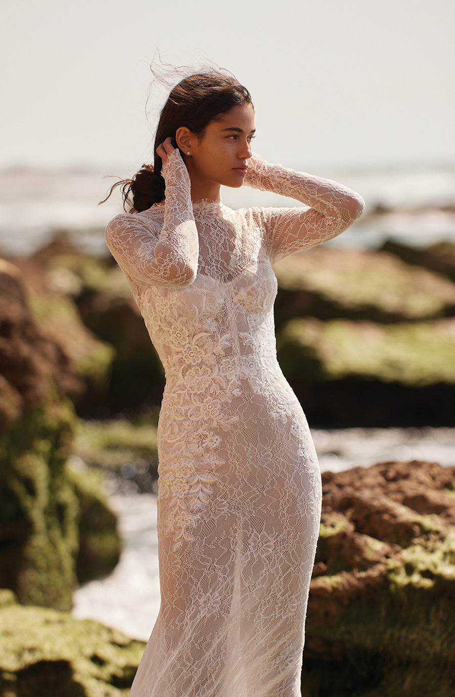 Glimmer with grace in the glamorous Robe Adrianna. This ethereal white lace mermaid dress features long sleeves for a timeless look, perfect for your most special of occasions. Experience luxury with a touch of romance, all in one breathtaking dress.