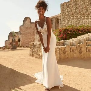 Expertly crafted with delicate lace appliques, the Dress Marietta is a stunning wedding dress with spaghetti straps and a flattering mermaid silhouette. Perfect for a beach wedding, the backless design adds a touch of allure to this elegant gown. Embrace your inner bride in the Dress Marietta.