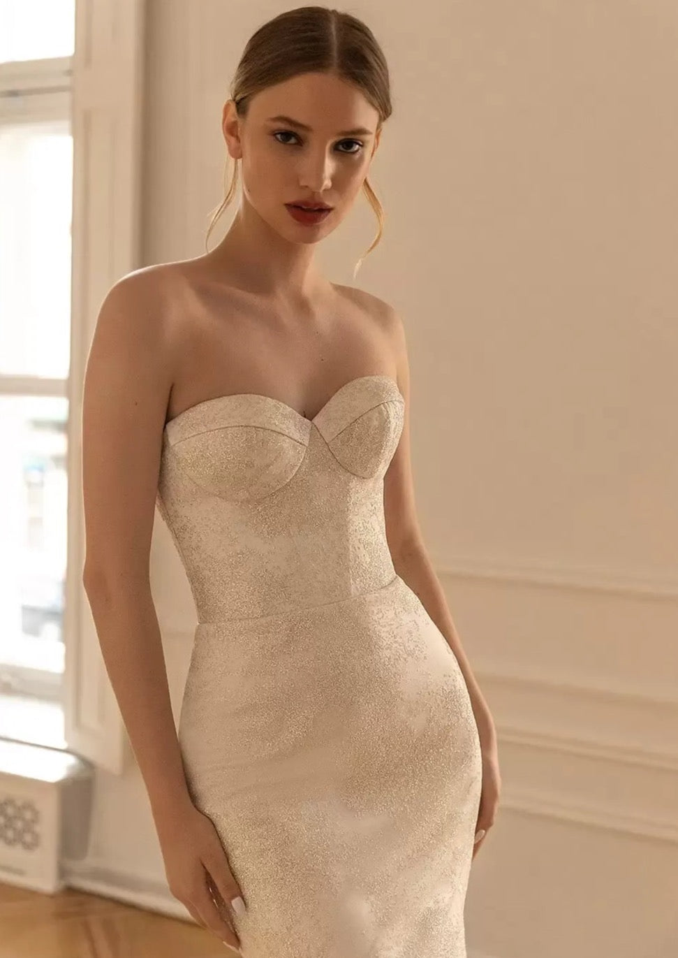 Get ready to fall in love with the Robe Brigitte! This two-piece lace bridal gown features a sweetheart sheath design and vintage vibes. Perfect for the playful, non-traditional bride. Say yes to the dress of your dreams!