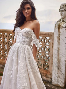 Indulge in the exquisite elegance of our Robe Domitille. This lace wedding dress boasts a stunning ball gown silhouette, designed to make any woman feel like royalty on her special day. With delicate lace detailing, this dress exudes luxury and sophistication, perfect for the most memorable moments.