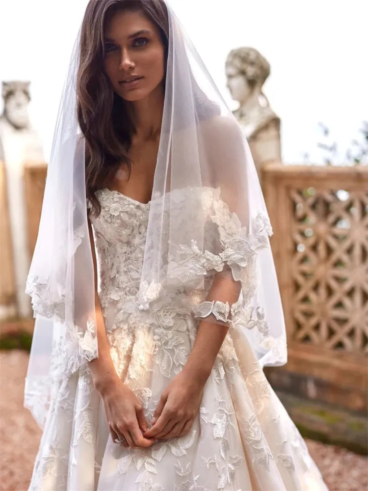 Indulge in the exquisite elegance of our Robe Domitille. This lace wedding dress boasts a stunning ball gown silhouette, designed to make any woman feel like royalty on her special day. With delicate lace detailing, this dress exudes luxury and sophistication, perfect for the most memorable moments.