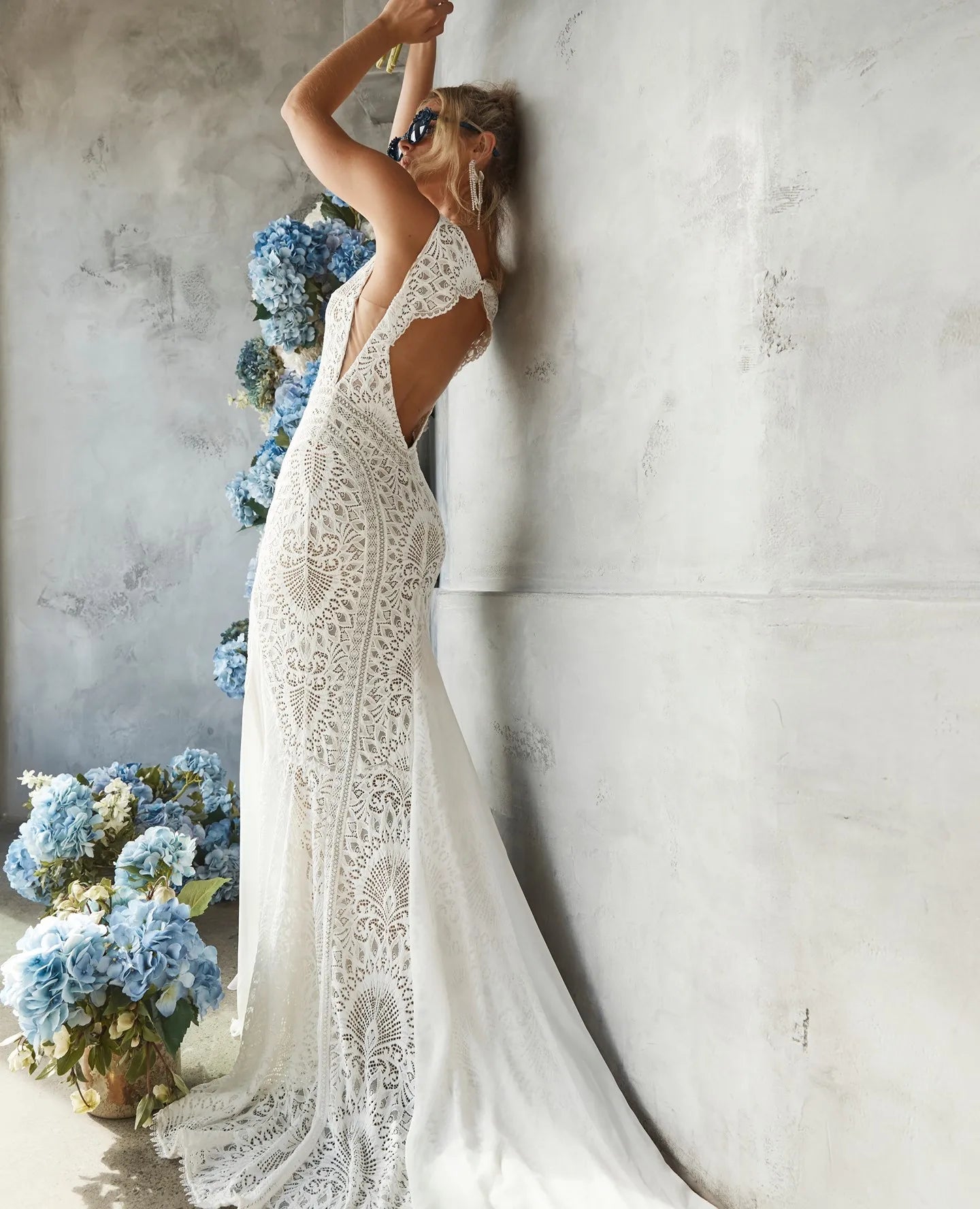 Indulge in the romantic allure of the Robe Perrine. This bohemian-inspired lace wedding dress is both simple and elegant, with a mermaid cut that effortlessly flatters your figure. The delicate lace adds a touch of sophistication, making you feel like a true siren on your special day.