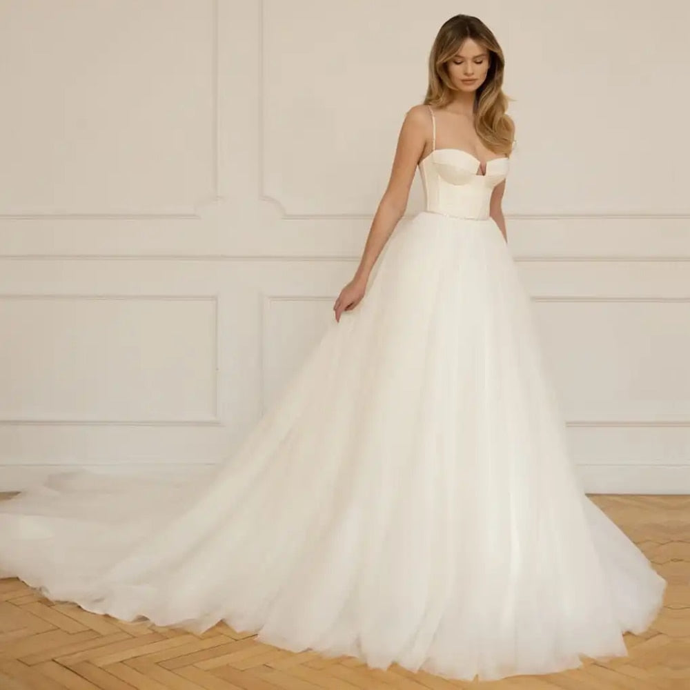 Look sensational in Robe Christina's luxurious wedding dress! Featuring a classic sweetheart neckline and spaghetti straps, this a-line gown adds effortless grace to any special day. Delicate beading and hand-crafted details ensures a beautiful and timeless look that celebrates your special day.