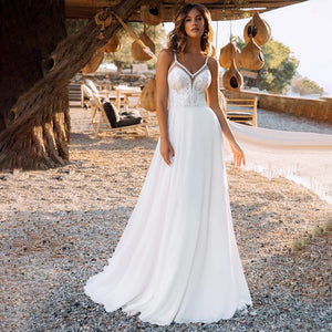 Feel like a boho bride in our Robe Lunette! This exquisite wedding dress features a detachable lace boloro, spaghetti straps, and a sweetheart neckline. The open back adds a touch of romance and femininity, perfect for your special day. Say yes to comfort and style with our Robe Lunette!