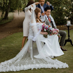 Indulge in the romance of a fairytale wedding with the Bloom Flowers Romantic Wedding Dress Michelle. This custom-made off-white mesh veil comes with a delicate blusher that adds elegance to your bridal look. The comb headpiece adds a touch of glamour and compliments your beauty on your special day.