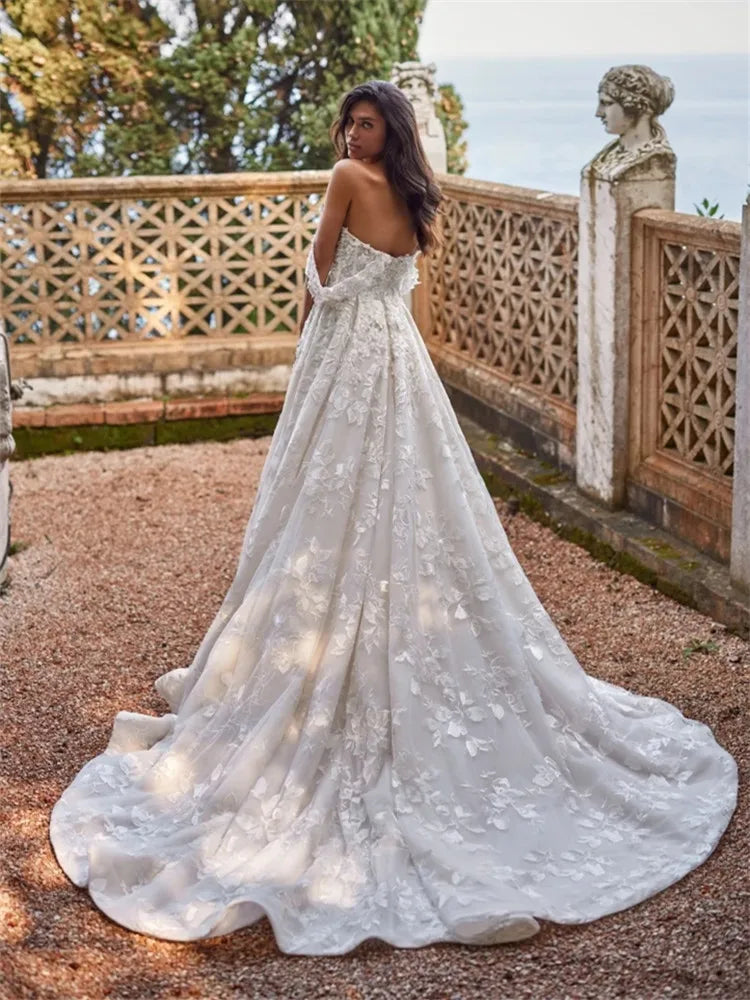 Indulge in the exquisite elegance of our Robe Domitille. This lace wedding dress boasts a stunning ball gown silhouette, designed to make any woman feel like royalty on her special day. With delicate lace detailing, this dress exudes luxury and sophistication, perfect for the most memorable moments.