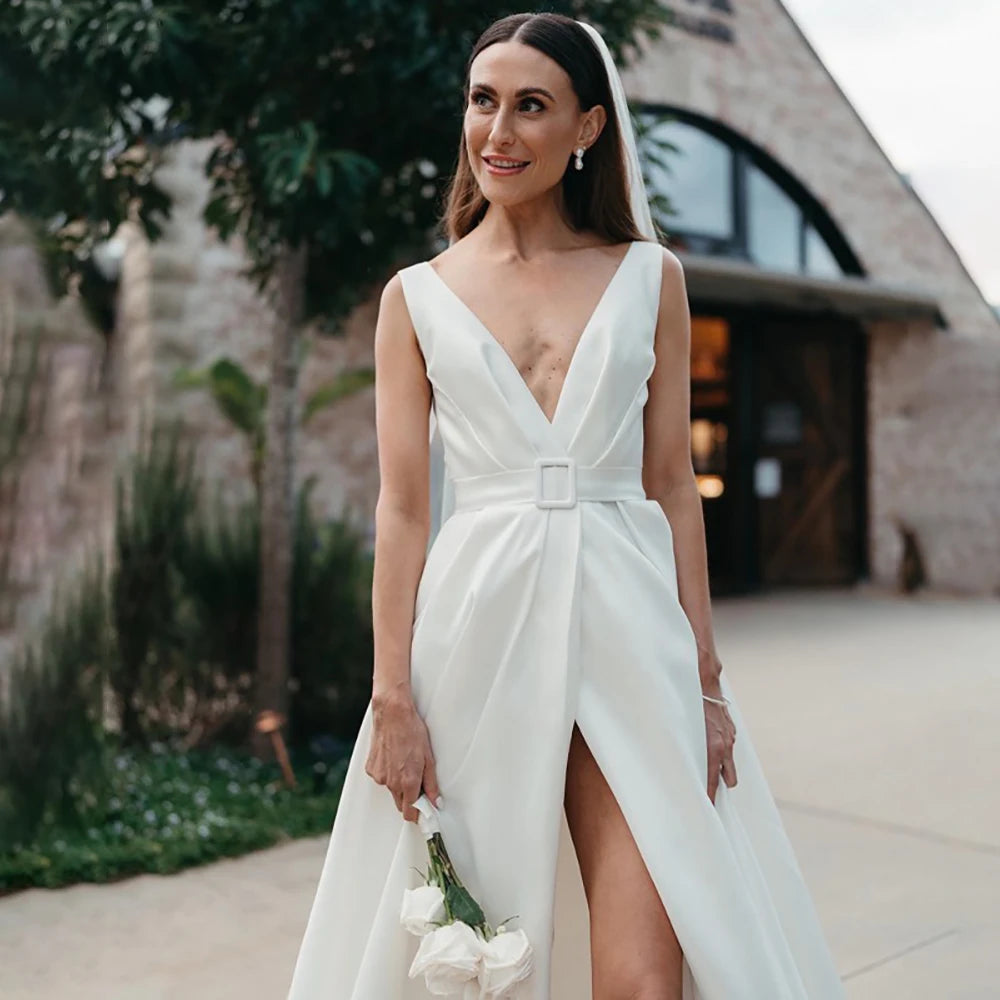 Indulge in the luxurious simplicity of the Robe Aude. Handcrafted from the finest satin, this custom-made wedding dress features a high split and open back, adding a touch of sensuality to its minimalist design. Ruched details complete the look, creating a luxe and elegant dress for your special day.