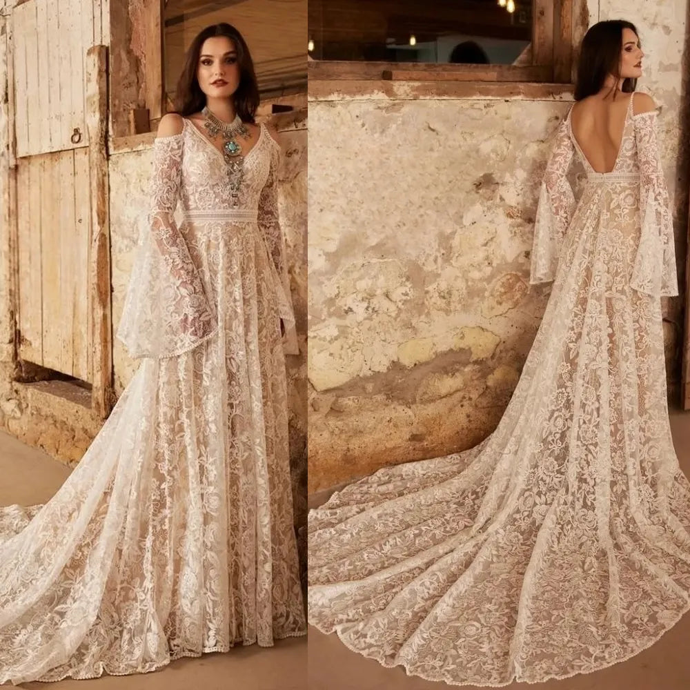 Indulge in the ethereal beauty of our Robe Vivien. This exquisite bridal gown features an empire V-neck, sweep floor length, cut-out open back, and delicate lace detailing. Elegantly crafted for your special day, it exudes grace and sophistication. Feel like a goddess on your wedding day with Robe Vivien.