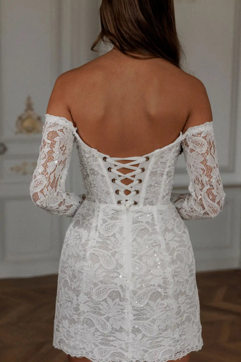 Expertly crafted with lace appliques and an elegant off shoulder design, the Robe Noemie is the perfect choice for any special occasion. The heart shaped neck adds a touch of romance to this elegant white mini dress. Make a statement and feel confident and beautiful all night long.