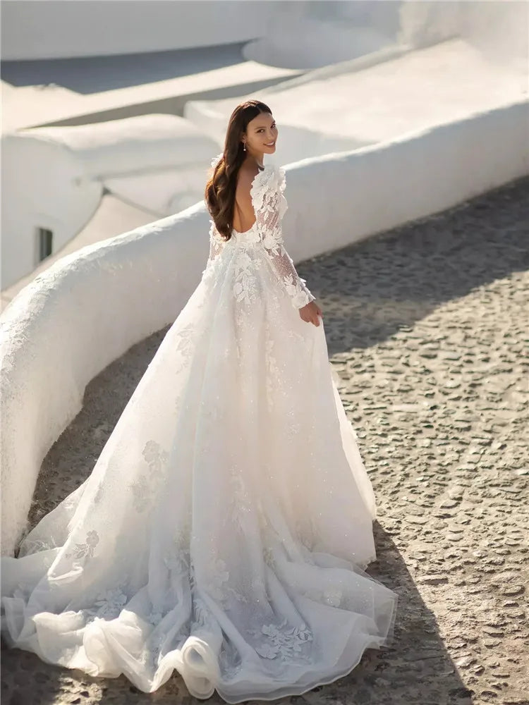 Experience timeless elegance with the Robe Elize! This Princess ball gown is crafted with delicate lace and features long sleeves, perfect for any wedding occasion. With a flattering fit, this dress will make any woman feel like royalty on her special day.