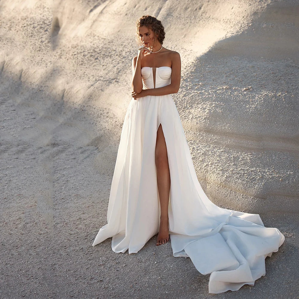 Looking for the perfect beach wedding dress? Look no further! Our Robe Angelique features an elegant deep V-neck design that will make you stand out on your special day. With its lightweight and flowy fabric, you'll feel comfortable and chic as you say "I do" with the ocean as your backdrop.