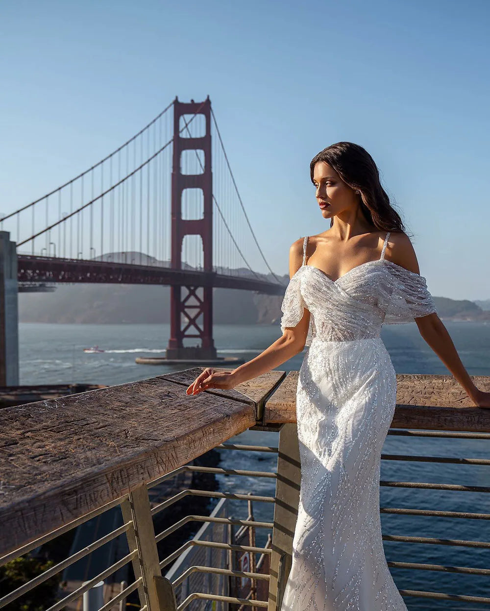 The Robe Tracy is a stunning Glitter Mermaid Wedding Dress with a detachable train and an off shoulder design. With its sparkly details, it will make any bride feel like a mermaid princess on her special day. Its unique features provide both style and convenience, making it a must-have for any bride-to-be.