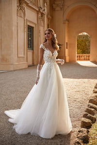 Get ready to sweep everyone off their feet in the Noelle Dress! This romantic off-the-shoulder gown features a heart-shaped bodice embroidered with floral lace and sequins, while the maxi skirt adds a touch of elegance. The open buttoned back and&nbsp; bow add the perfect finishing touches. Get ready to turn heads in this stunning gown!