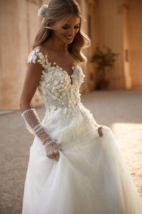 Get ready to sweep everyone off their feet in the Noelle Dress! This romantic off-the-shoulder gown features a heart-shaped bodice embroidered with floral lace and sequins, while the maxi skirt adds a touch of elegance. The open buttoned back and&nbsp; bow add the perfect finishing touches. Get ready to turn heads in this stunning gown!