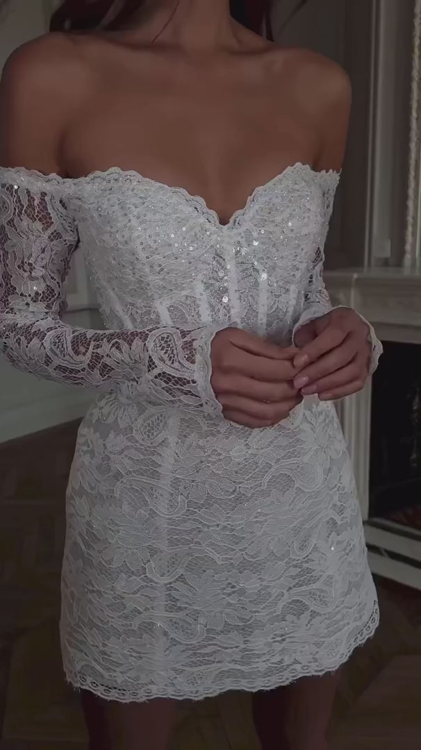 Expertly crafted with lace appliques and an elegant off shoulder design, the Robe Noemie is the perfect choice for any special occasion. The heart shaped neck adds a touch of romance to this elegant white mini dress. Make a statement and feel confident and beautiful all night long.