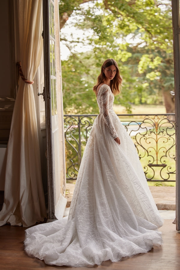 Indulge in pure elegance with our Mirae Gown. This chic A-line gown is designed to sparkle and captivate, making it the perfect choice for any bridal occasion. Its romantic silhouette will make you feel like a true princess on your special day. Upgrade your bridal look with this stunning dress.